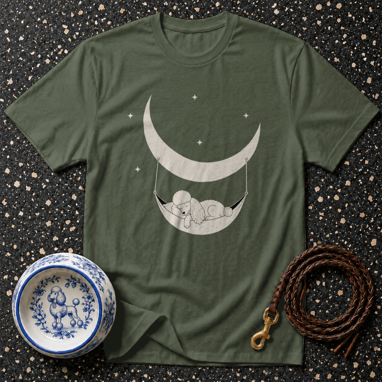 Green t-shirt with a poodle sleeping in a hammock under a crescent moon.