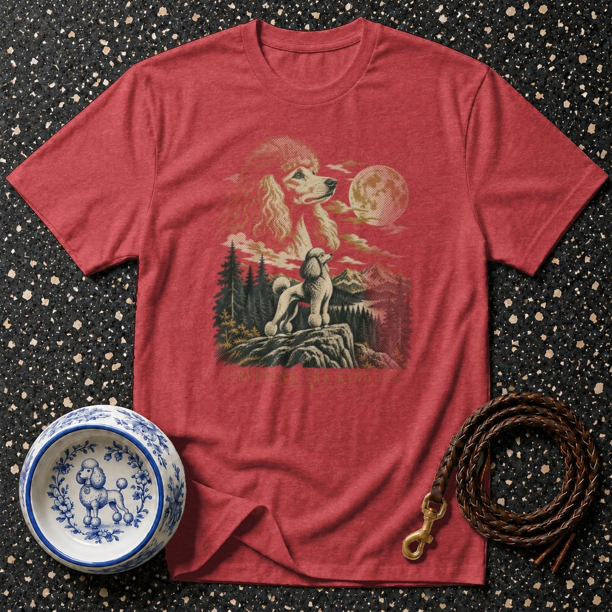 Red t-shirt with graphic of two poodles in a mountain landscape under a full moon.