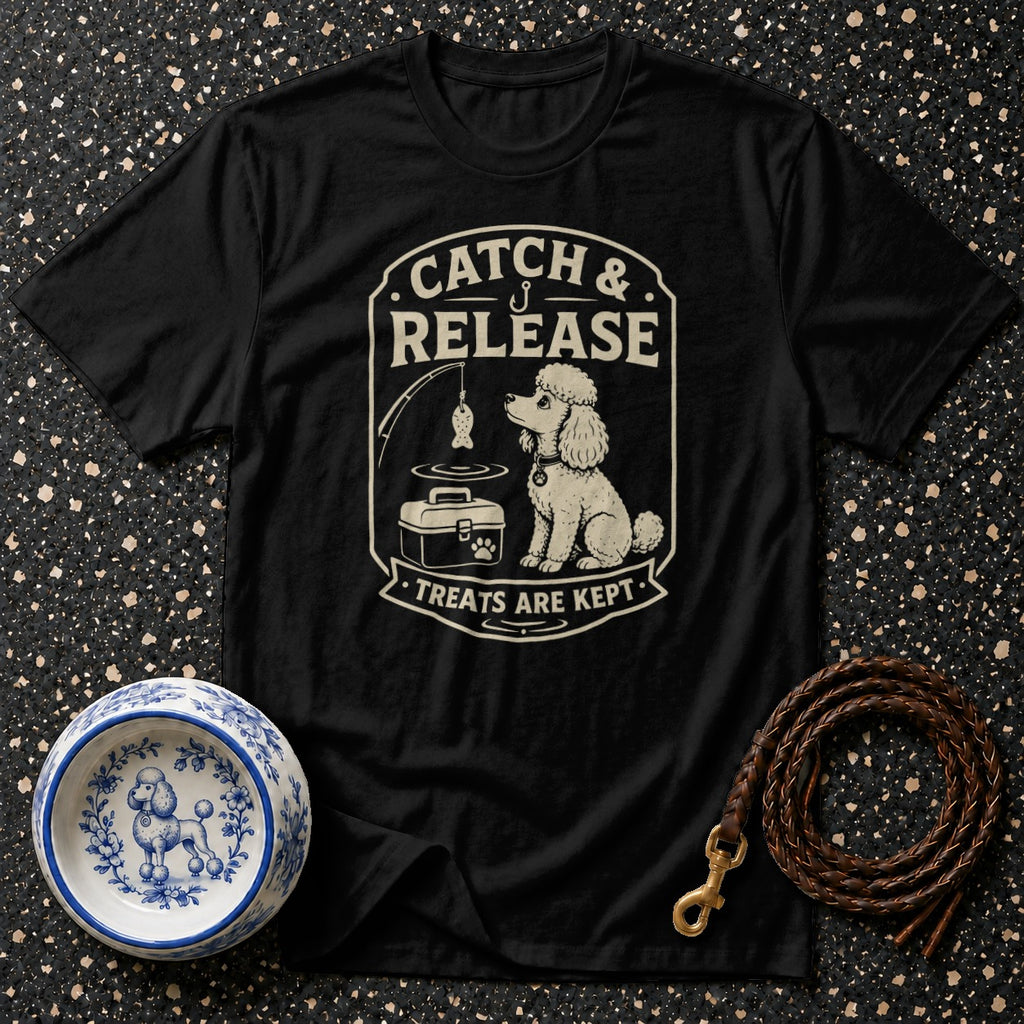 Black t-shirt with cream graphic of a poodle fishing, saying "Catch & Release, Treats are Kept."