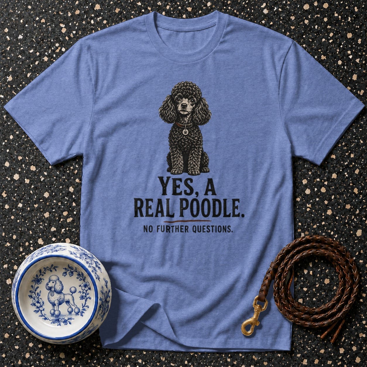 Blue t-shirt with black poodle graphic. Text reads "YES, A REAL POODLE. NO FURTHER QUESTIONS."