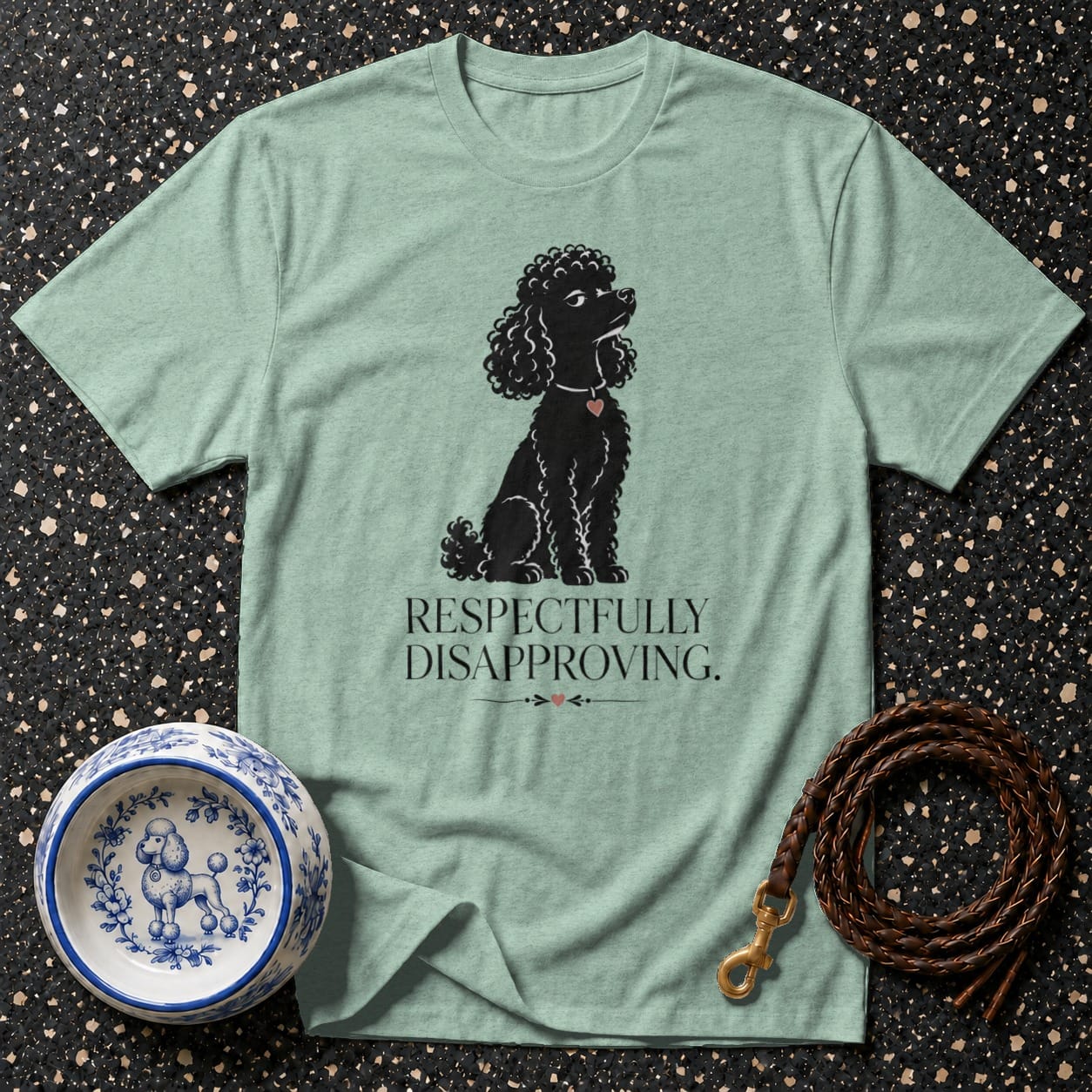 Mint t-shirt with black poodle graphic and text "RESPECTFULLY DISAPPROVING."