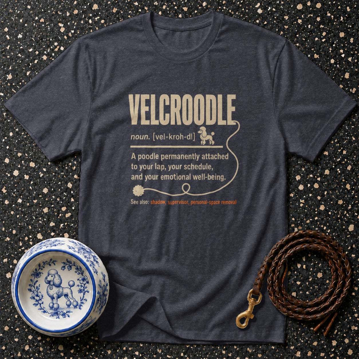 Dark grey t-shirt with "VELCROODLE" definition and dog-themed accessories.