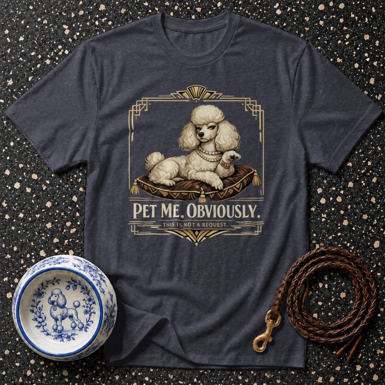 Dark grey t-shirt with a white poodle on a pillow and text "PET ME. OBVIOUSLY."