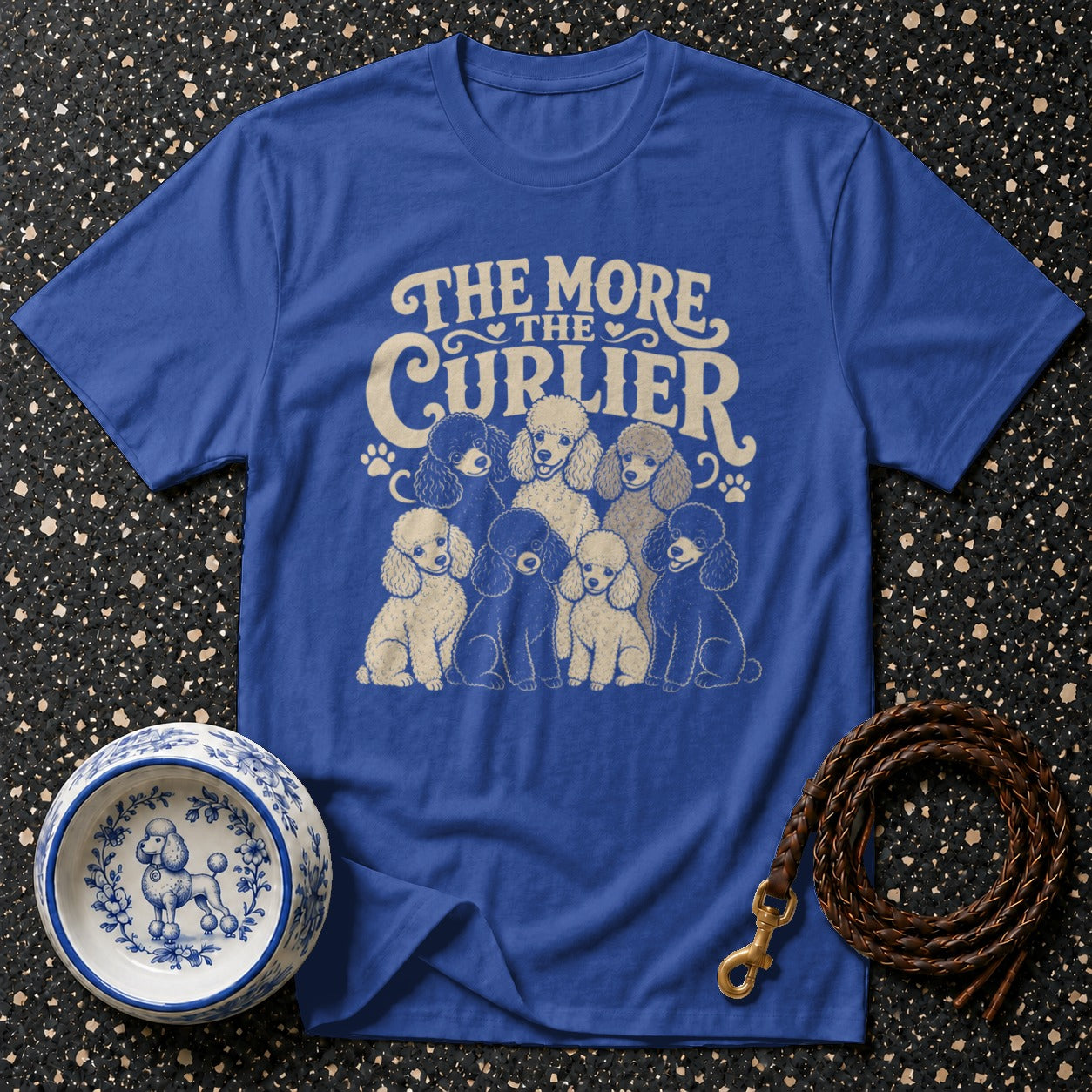 Blue t-shirt with vintage-style poodles and text "The More The Curlier".
