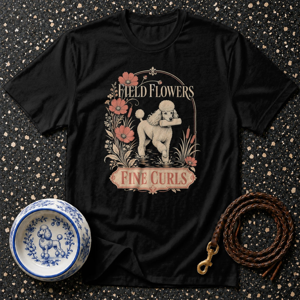 Black t-shirt with poodle, flowers, and text "Field Flowers Fine Curls".