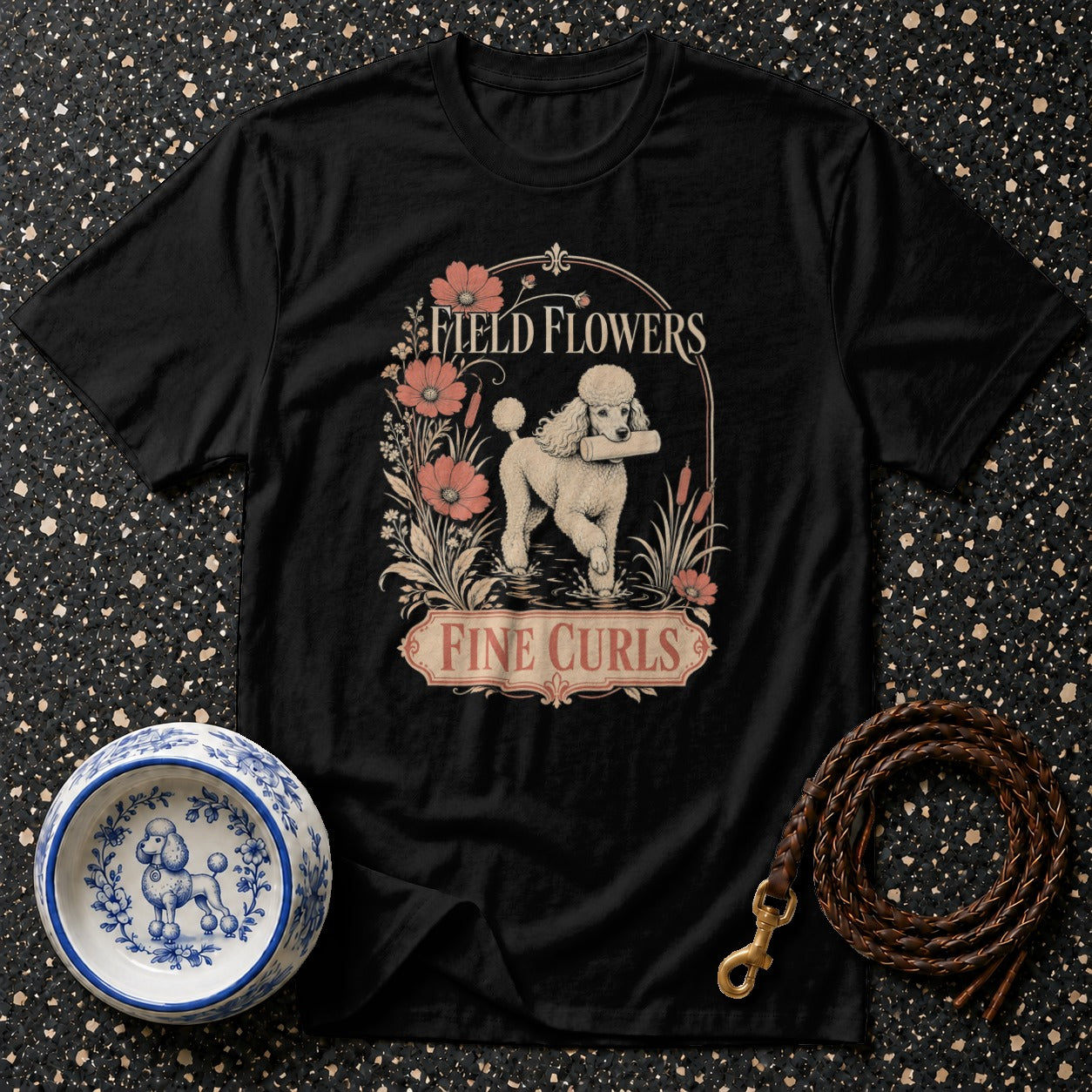Black t-shirt with poodle, flowers, and text "Field Flowers Fine Curls".