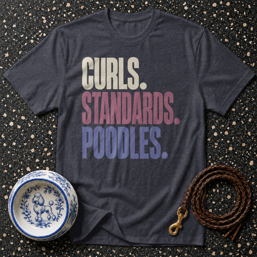 Dark grey t-shirt with text "Curls. Standards. Poodles." on a speckled background.
