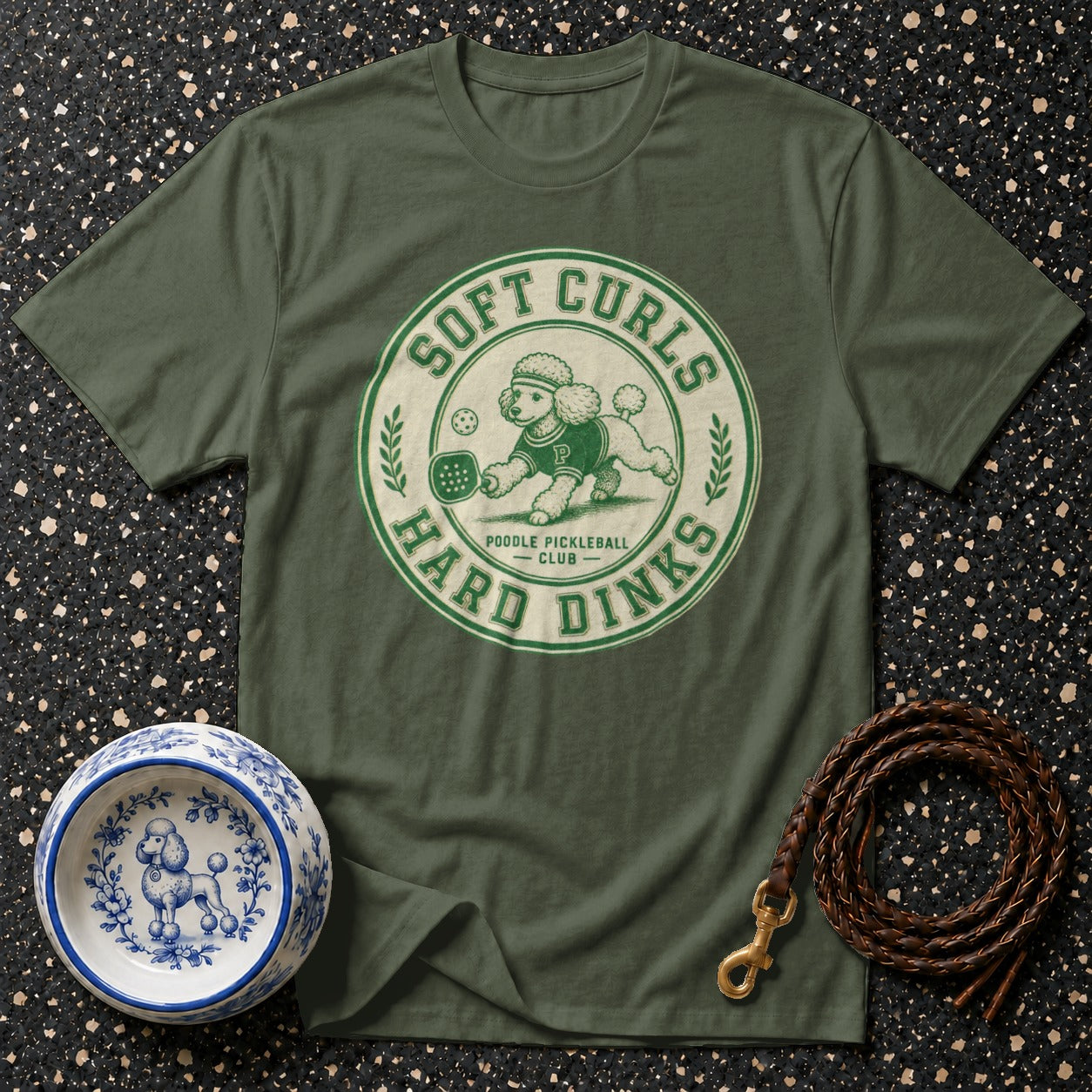 Green t-shirt with "Soft Curls Hard Dinks Poodle Pickleball Club" graphic.