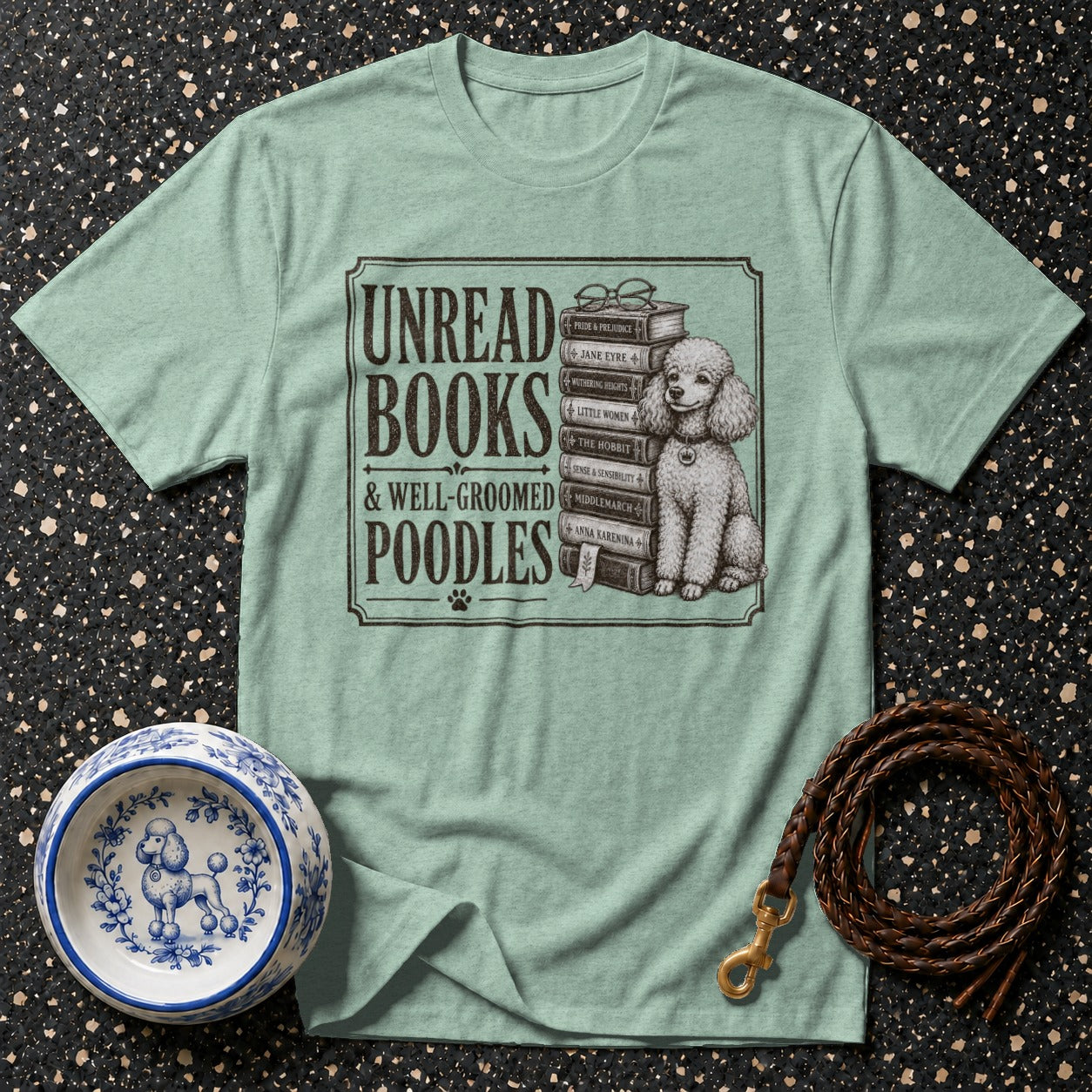 T-shirt with text "Unread Books & Well-Groomed Poodles" and a poodle next to books.