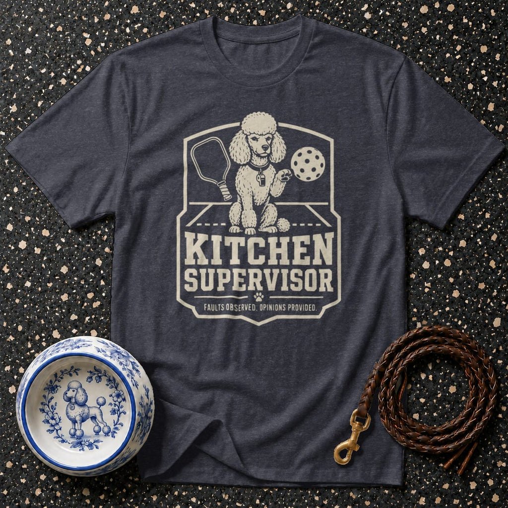 Dark t-shirt features a distressed graphic of a poodle with pickleball gear and text reading "Kitchen Supervisor".