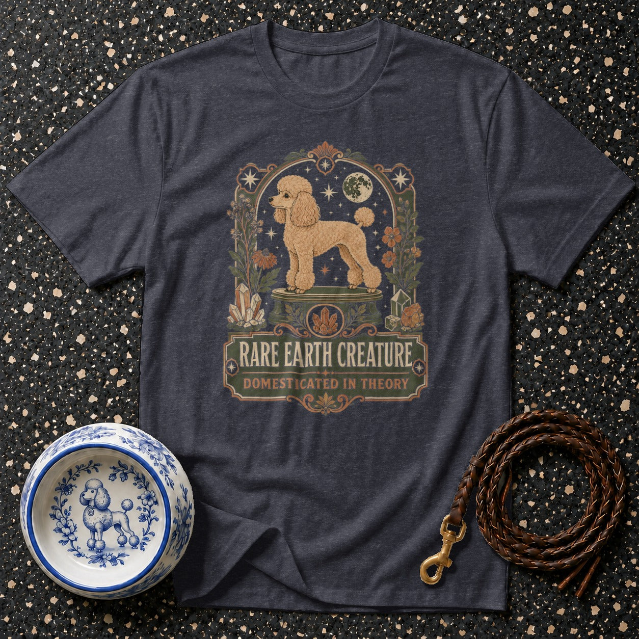 Dark grey t-shirt with a poodle art print that reads "Rare Earth Creature Domesticated in Theory."