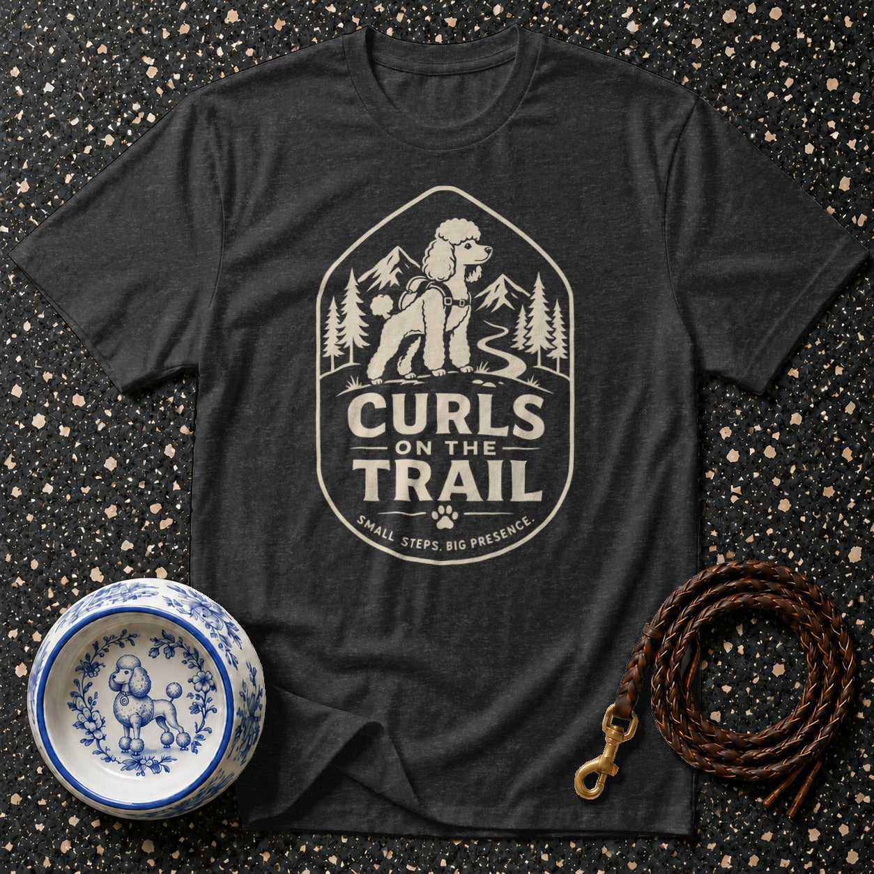 Dark grey t-shirt with a poodle on a trail graphic reading "Curls On The Trail".