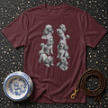 Maroon t-shirt with multiple grey poodle illustrations and a decorative dog bowl.