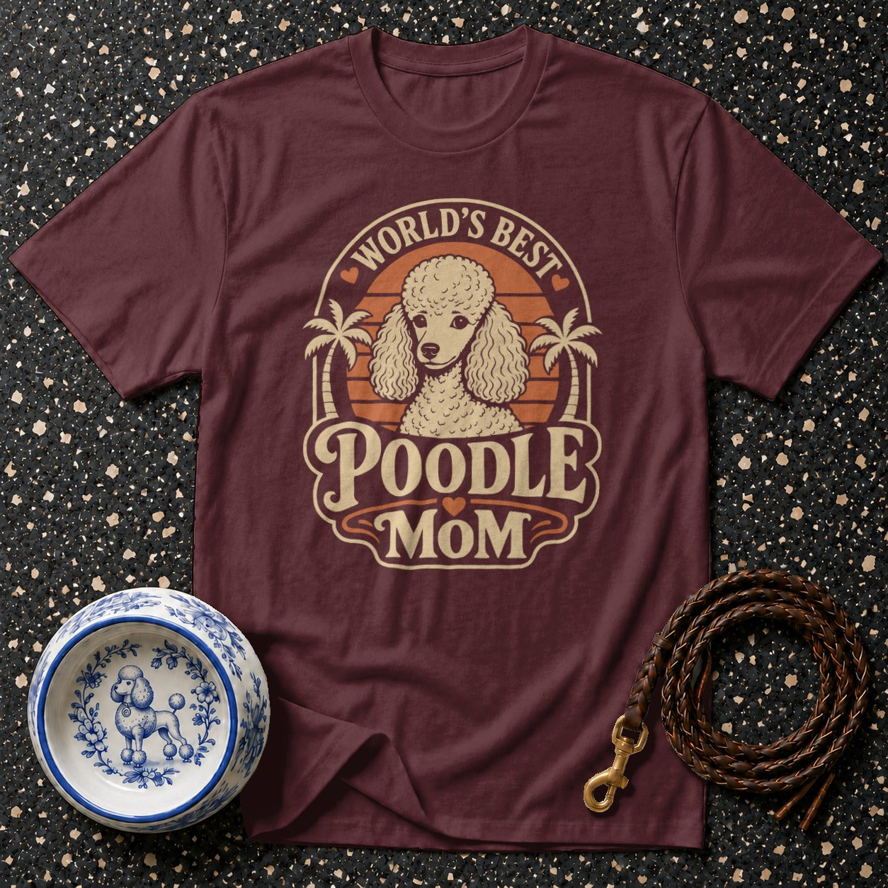 Burgundy t-shirt with a poodle graphic and text "World's Best Poodle Mom".