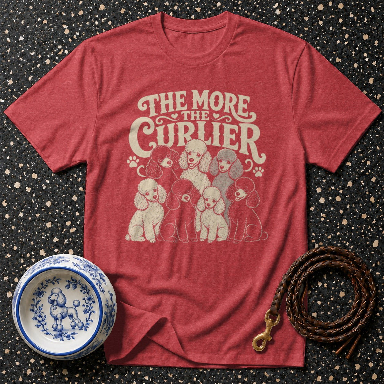 Red t-shirt with "The More The Curlier" text and group of poodles.