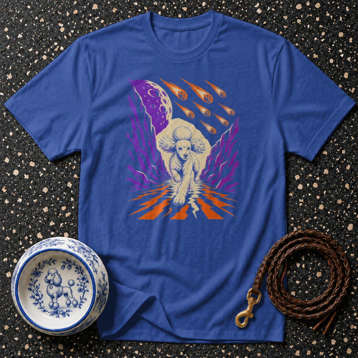 Blue t-shirt with a poodle running under a meteor shower.