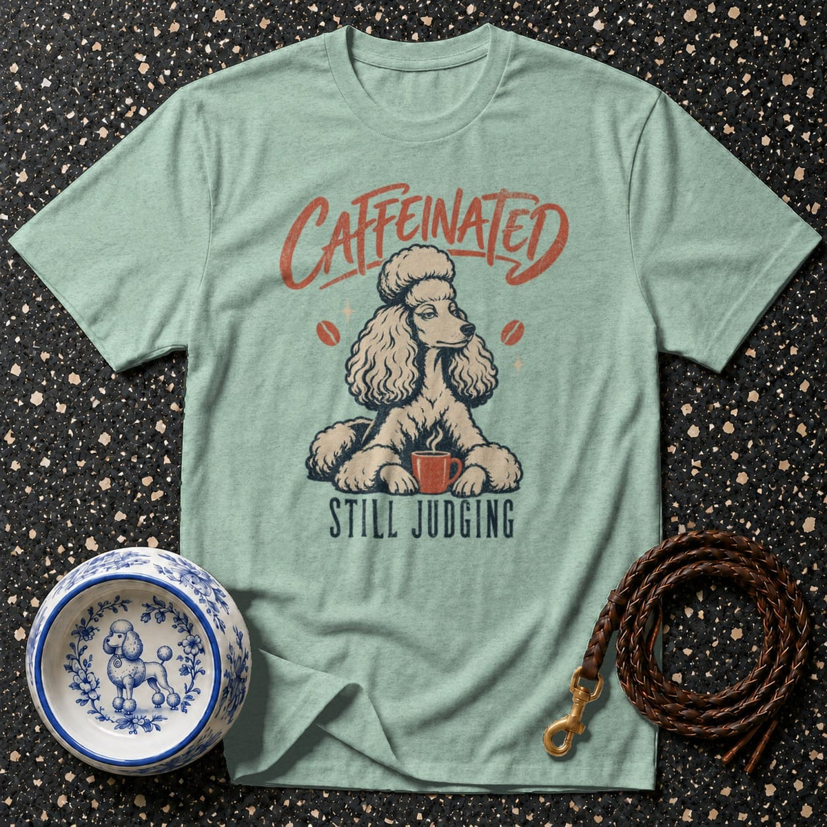 Light blue t-shirt with "CAFFEINATED STILL JUDGING" and poodle graphic.