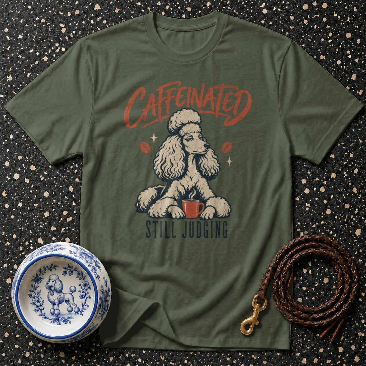 Green t-shirt with a poodle and text "Caffeinated Still Judging".