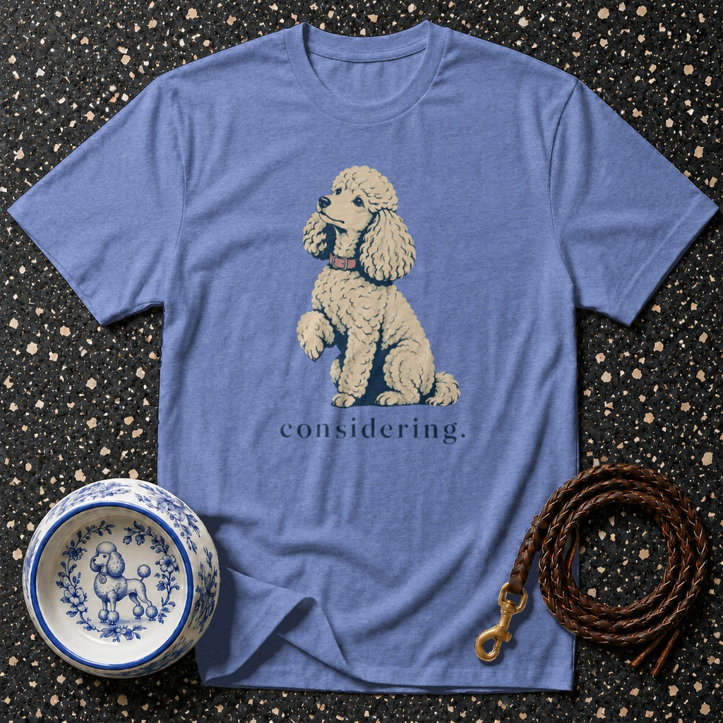 Blue t-shirt with a poodle graphic and the word "considering."