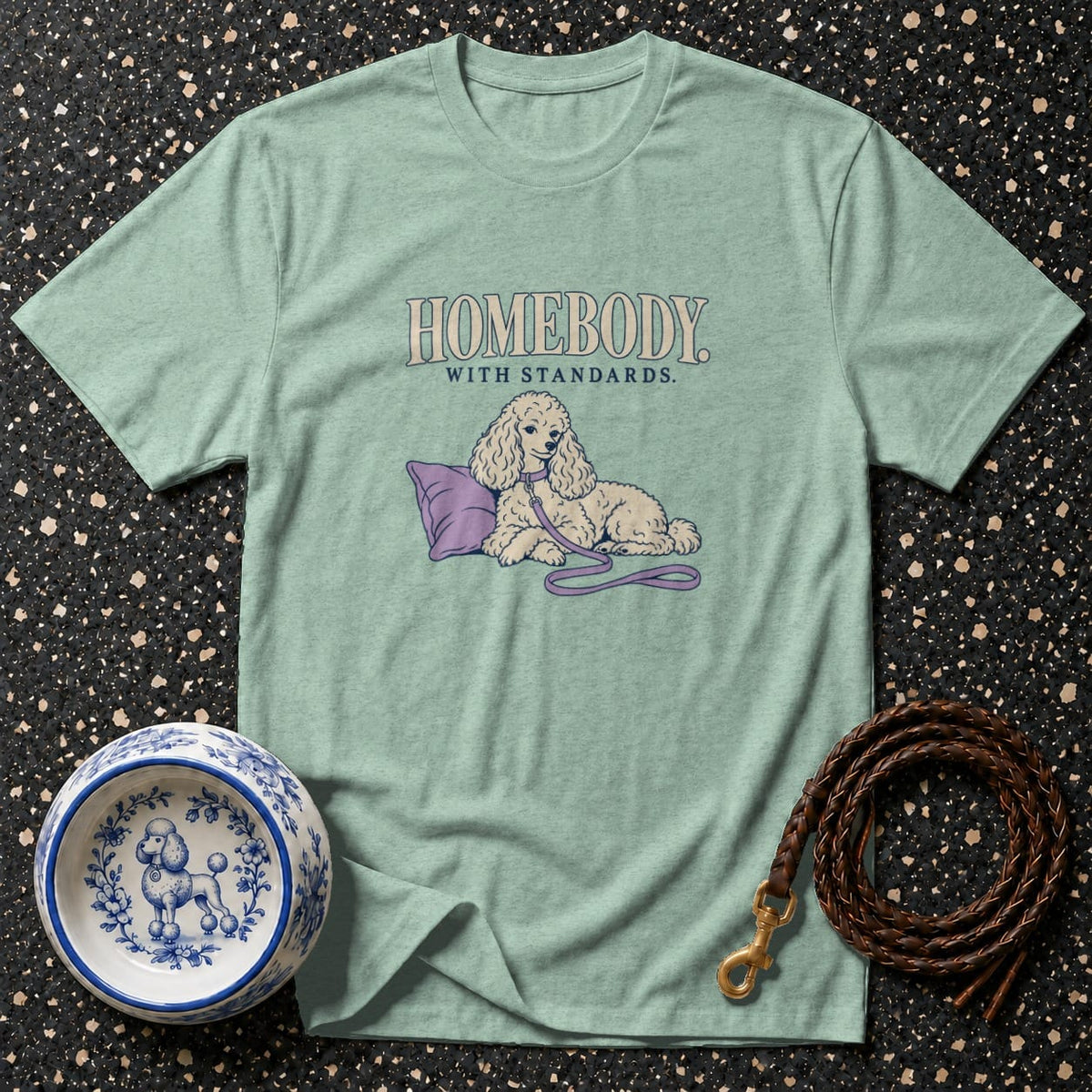 Light blue t-shirt with "HOMEBODY WITH STANDARDS" and a poodle illustration.
