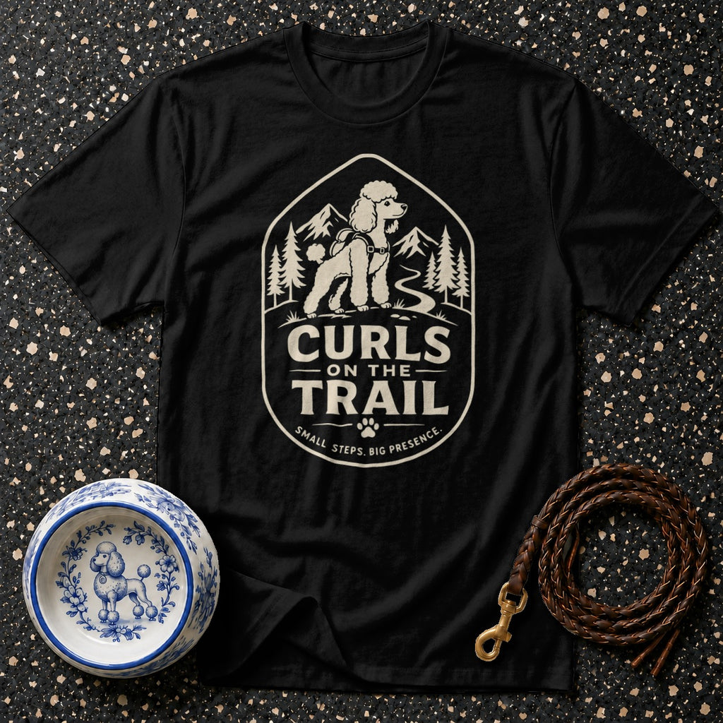 Black t-shirt with "Curls on the Trail" graphic of a poodle on a mountain background.