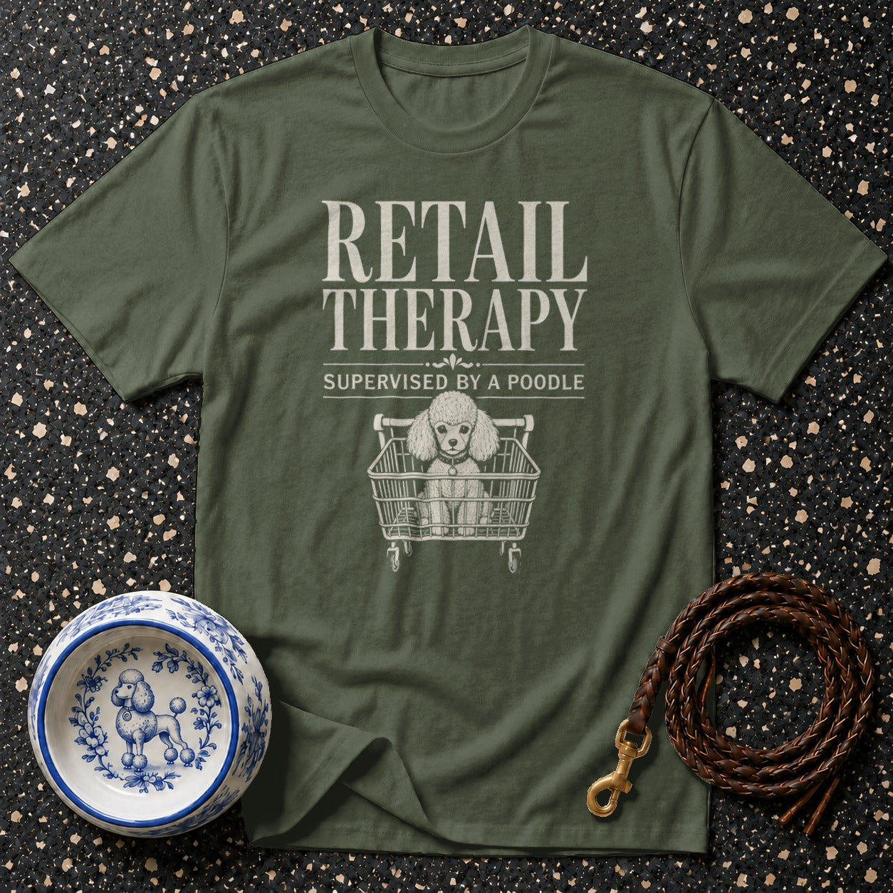 Olive green t-shirt with "Retail Therapy Supervised by a Poodle" and poodle in a shopping cart.