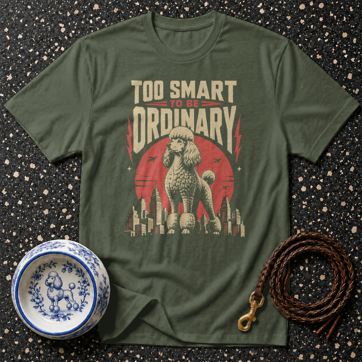 Green t-shirt with "Too Smart to Be Ordinary" text and a poodle over a city skyline.
