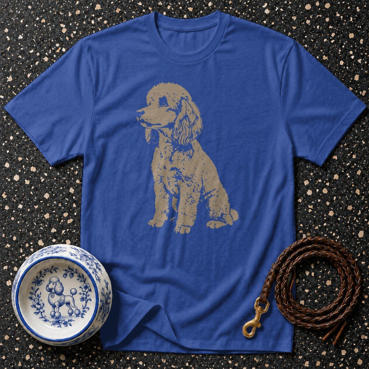 Blue t-shirt with poodle graphic, dog bowl, and leather leash.