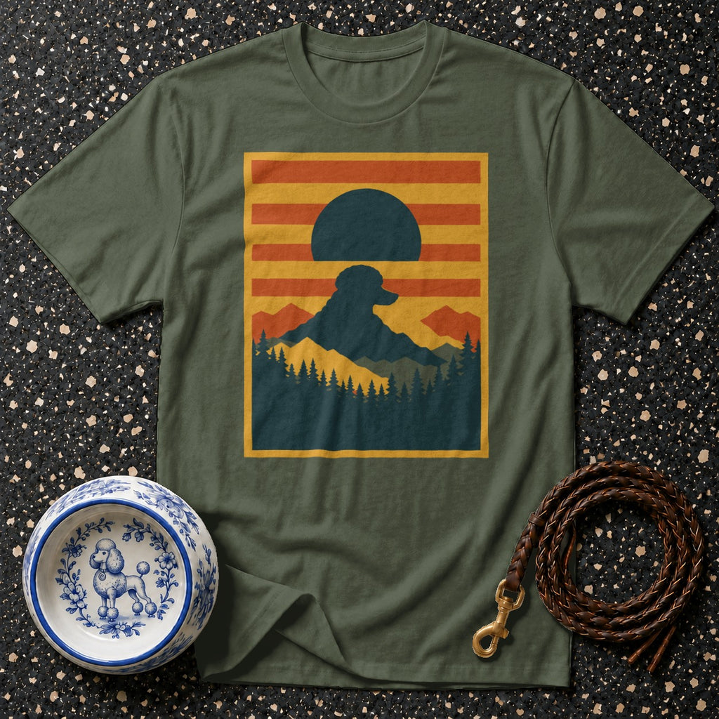 Green t-shirt with a mountain sunset scene featuring a dog silhouette.