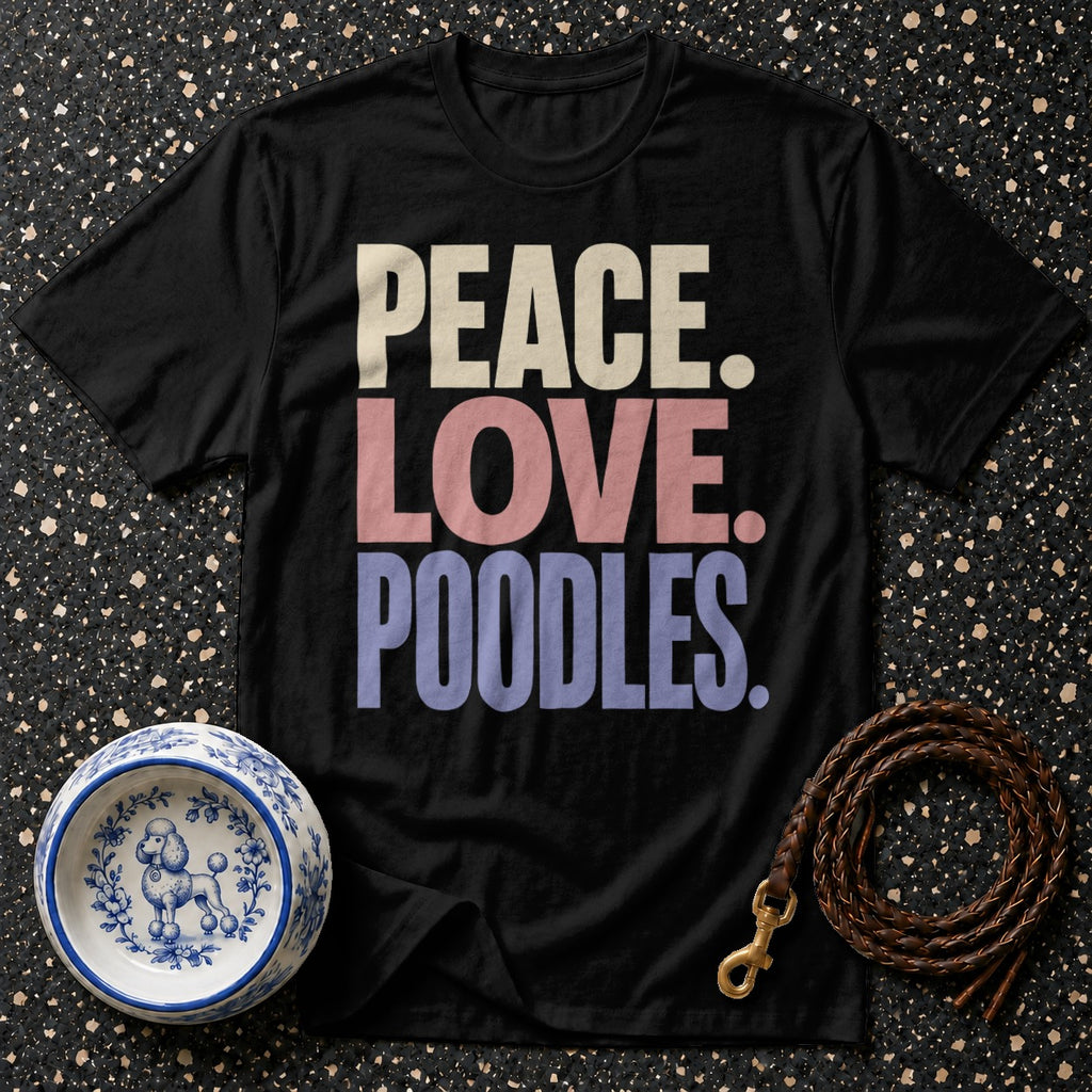 Black t-shirt with text "PEACE. LOVE. POODLES.", a dog bowl, and a leash.