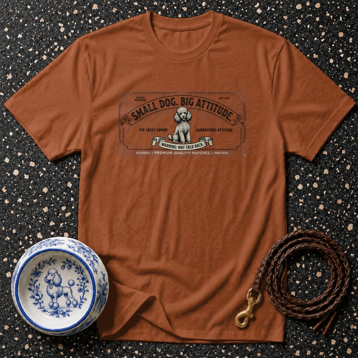 Brown t-shirt with "Small Dog. Big Attitude." text and poodle graphic.