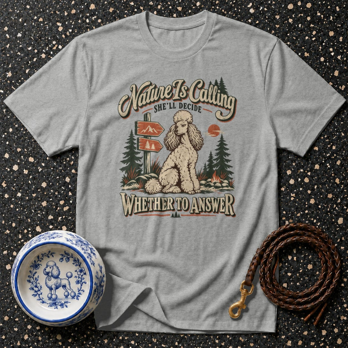 Grey t-shirt with a poodle and "Nature Is Calling" text graphic.