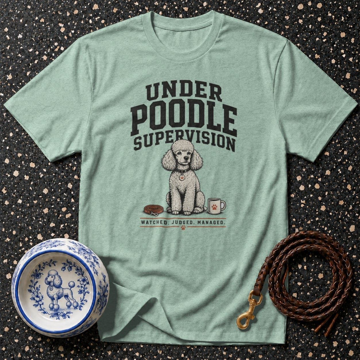 Pistachio t-shirt with a poodle illustration and text "Under Poodle Supervision".