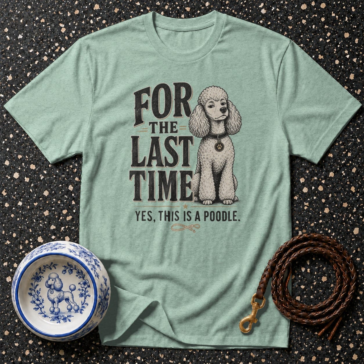 Light blue t-shirt with a poodle graphic and "For the last time, yes, this is a poodle" text.