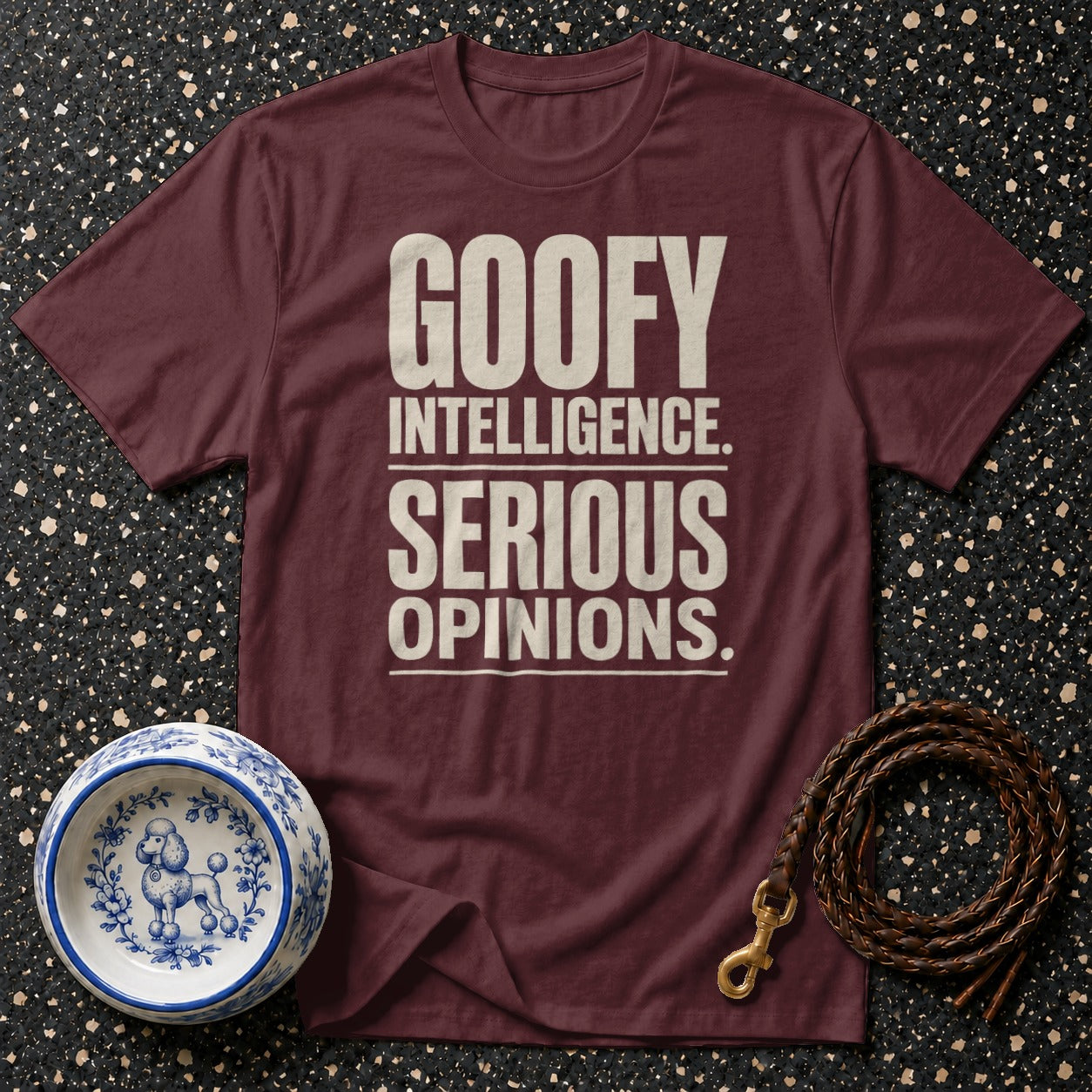 Maroon t-shirt with text "GOOFY INTELLIGENCE. SERIOUS OPINIONS."