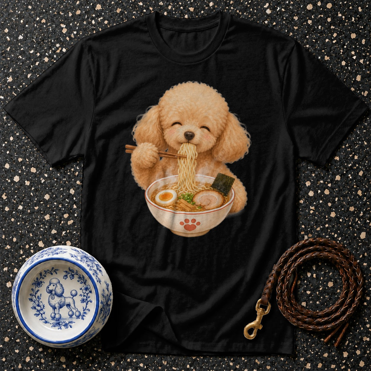 Black t-shirt with cartoon poodle eating ramen noodles and a small dog bowl.