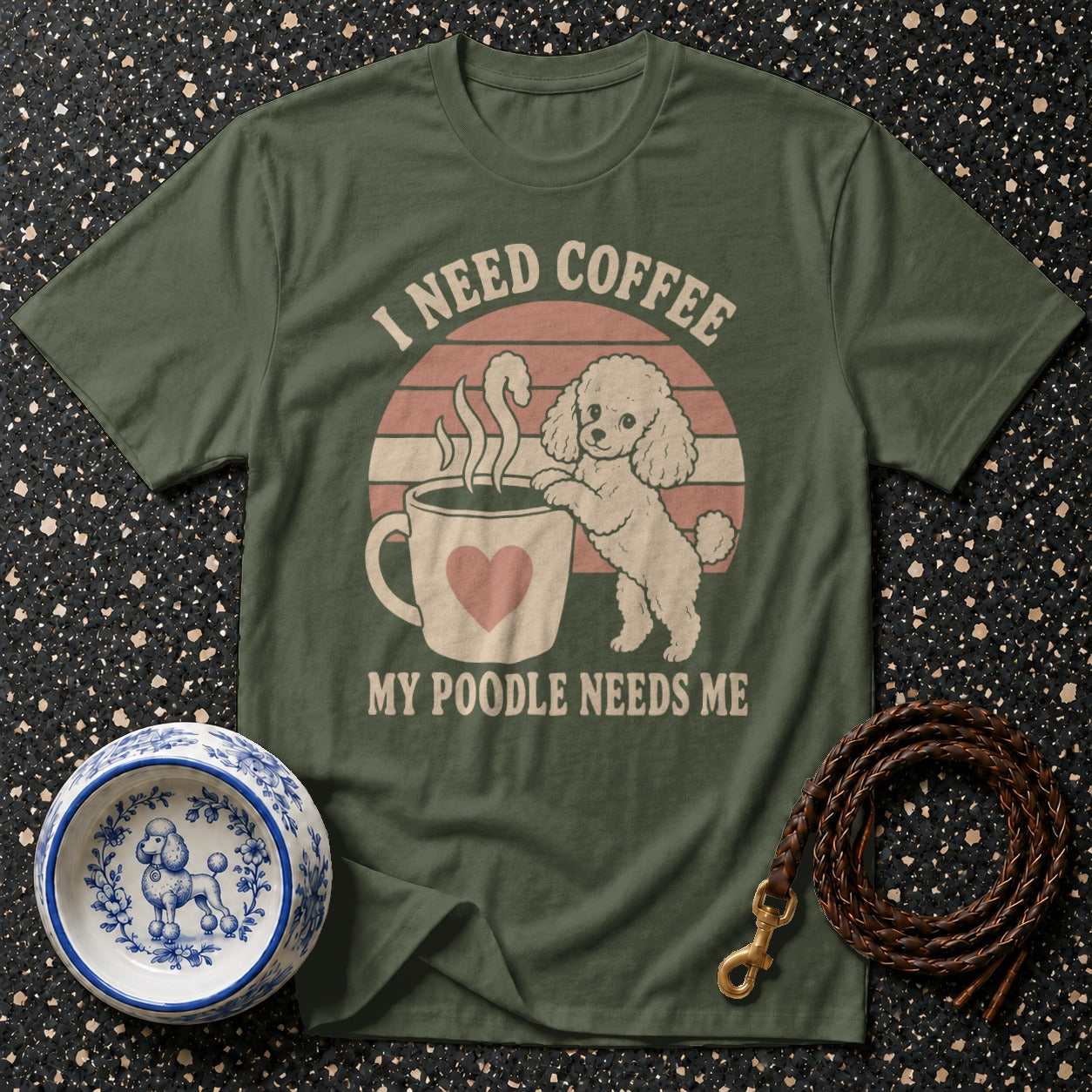 Green t-shirt with "I need coffee, my poodle needs me" text and poodle graphic.