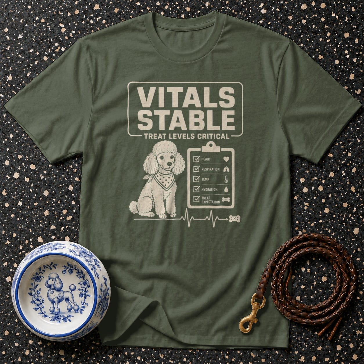 Green t-shirt with poodle graphic and "Vitals Stable Treat Levels Critical" text.