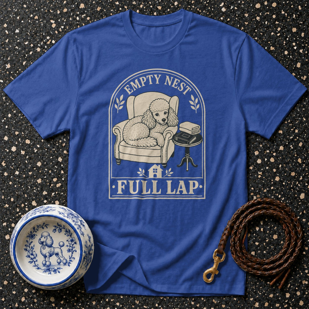 Blue t-shirt with poodle sitting in armchair, text "EMPTY NEST FULL LAP".