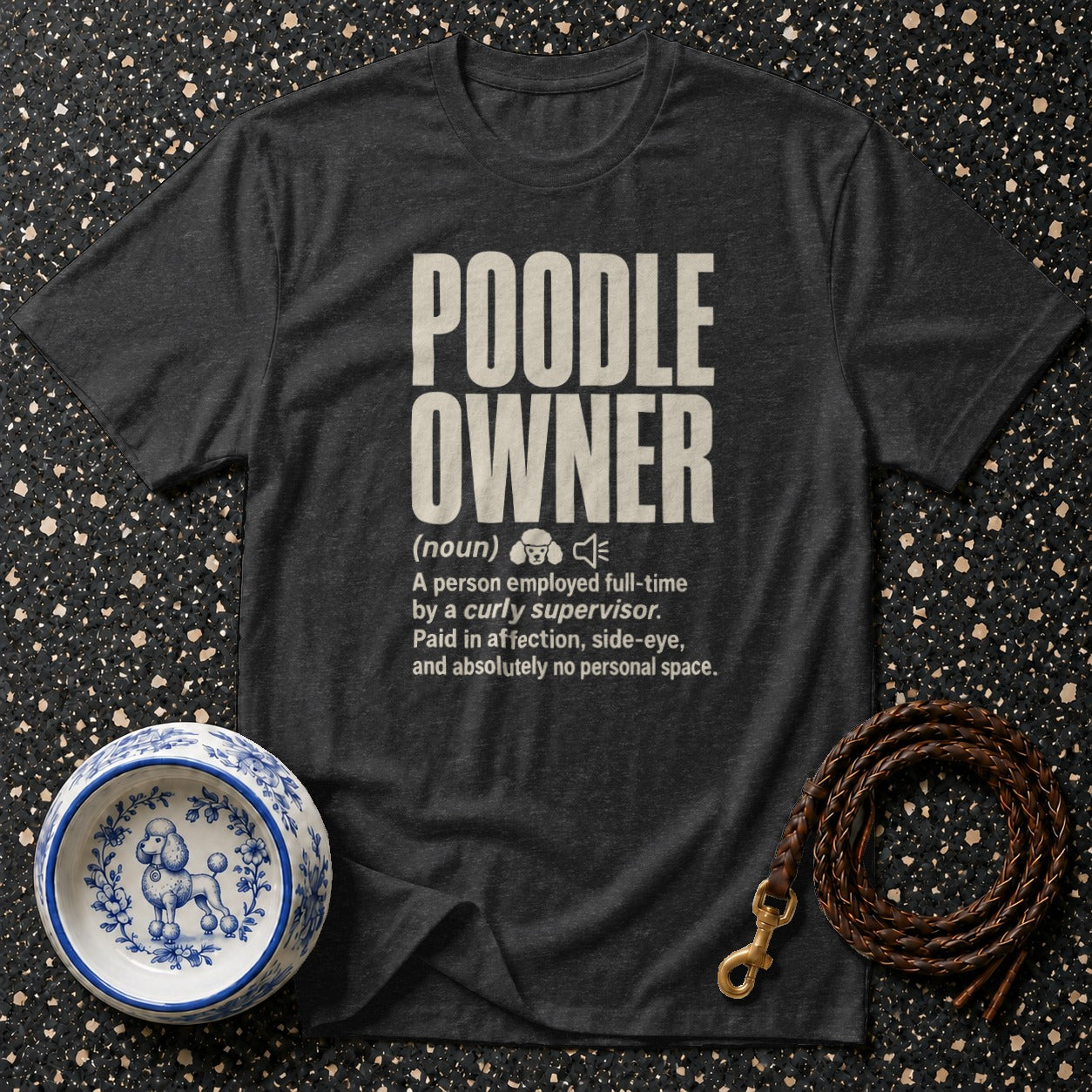 Dark t-shirt with "POODLE OWNER (noun) A person employed full-time by a curly supervisor." text.