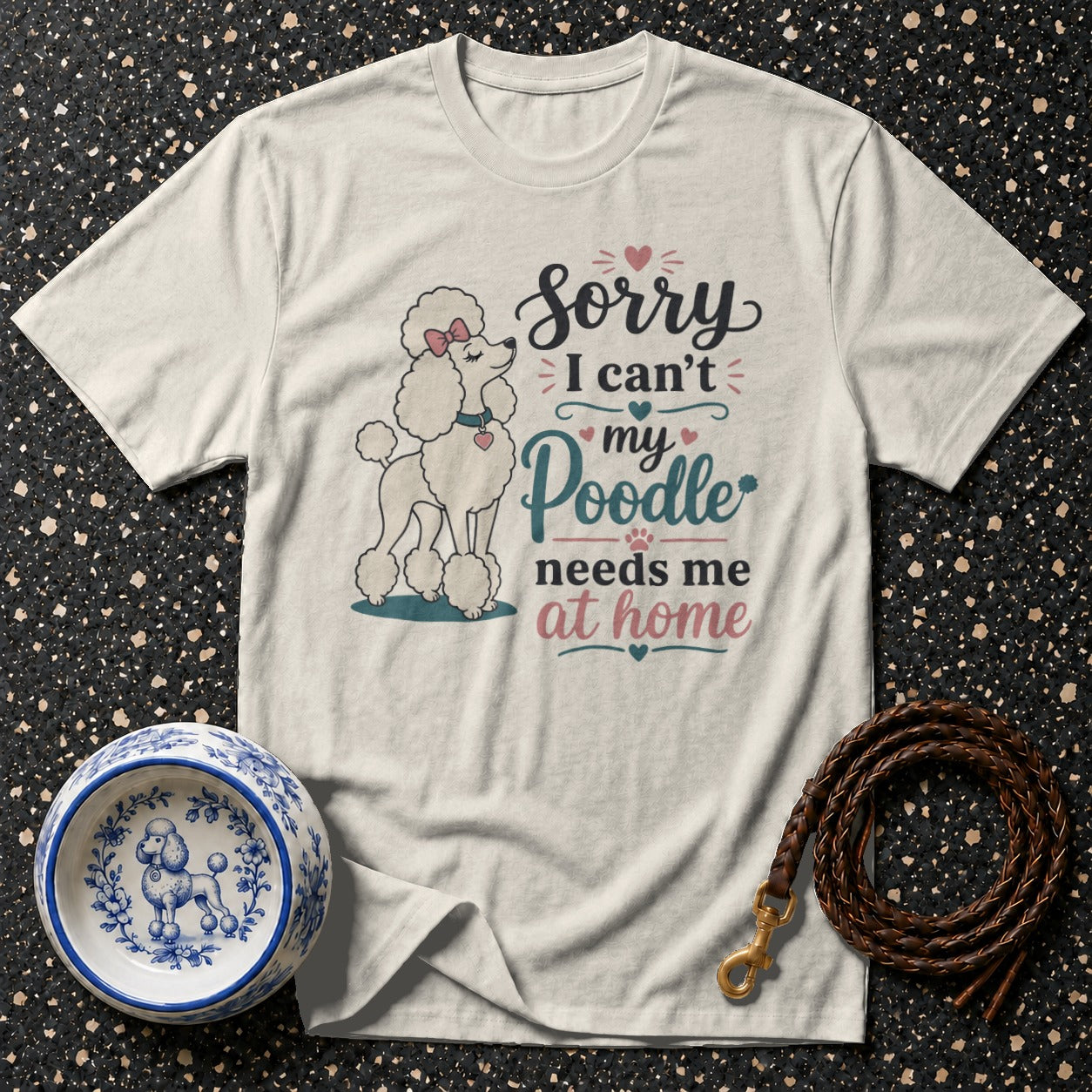 White t-shirt with a cartoon poodle and text "Sorry I can't my Poodle needs me at home."