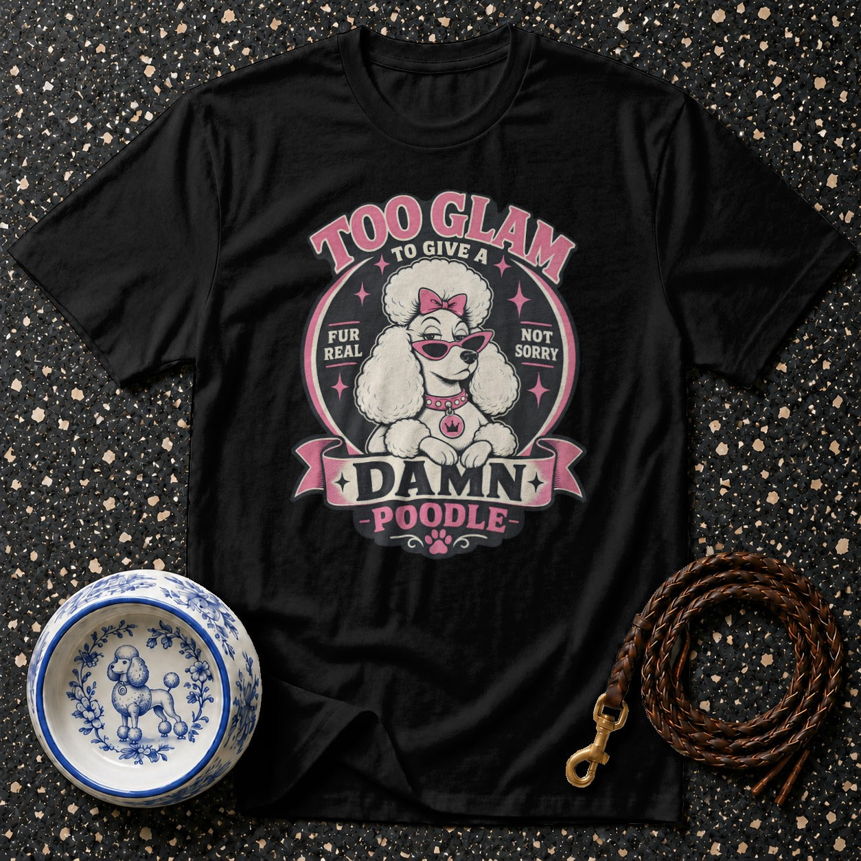 Black t-shirt with a white poodle wearing sunglasses and text "Too Glam to Give a Damn Poodle".