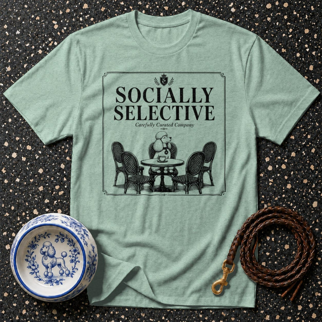 Light green t-shirt with "Socially Selective" text and poodle at ornate table graphic.