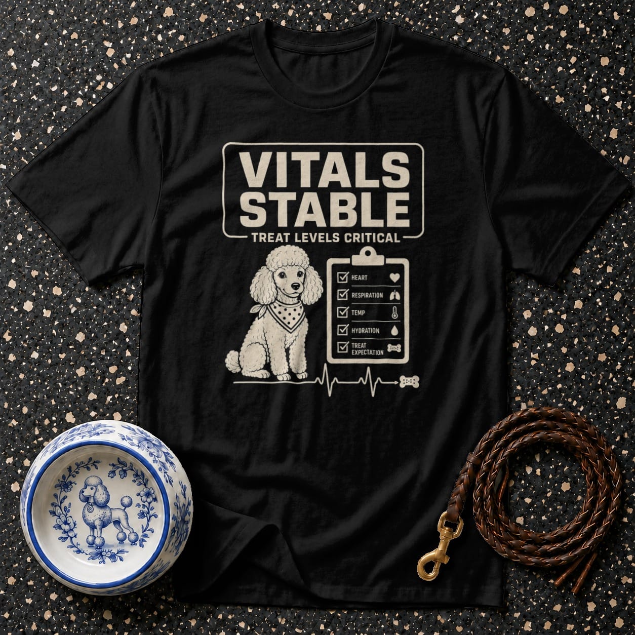 Black t-shirt with a poodle graphic and "Vitals Stable" checklist text.