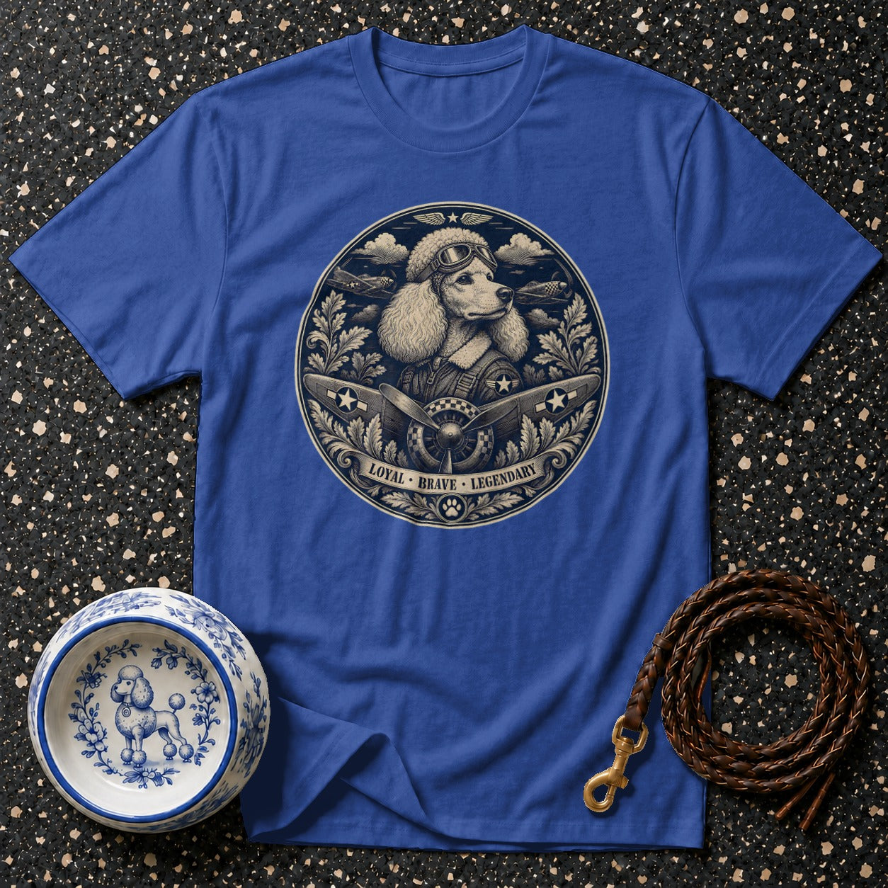 Blue t-shirt with poodle pilot graphic and "Loyal Brave Legendary" text.