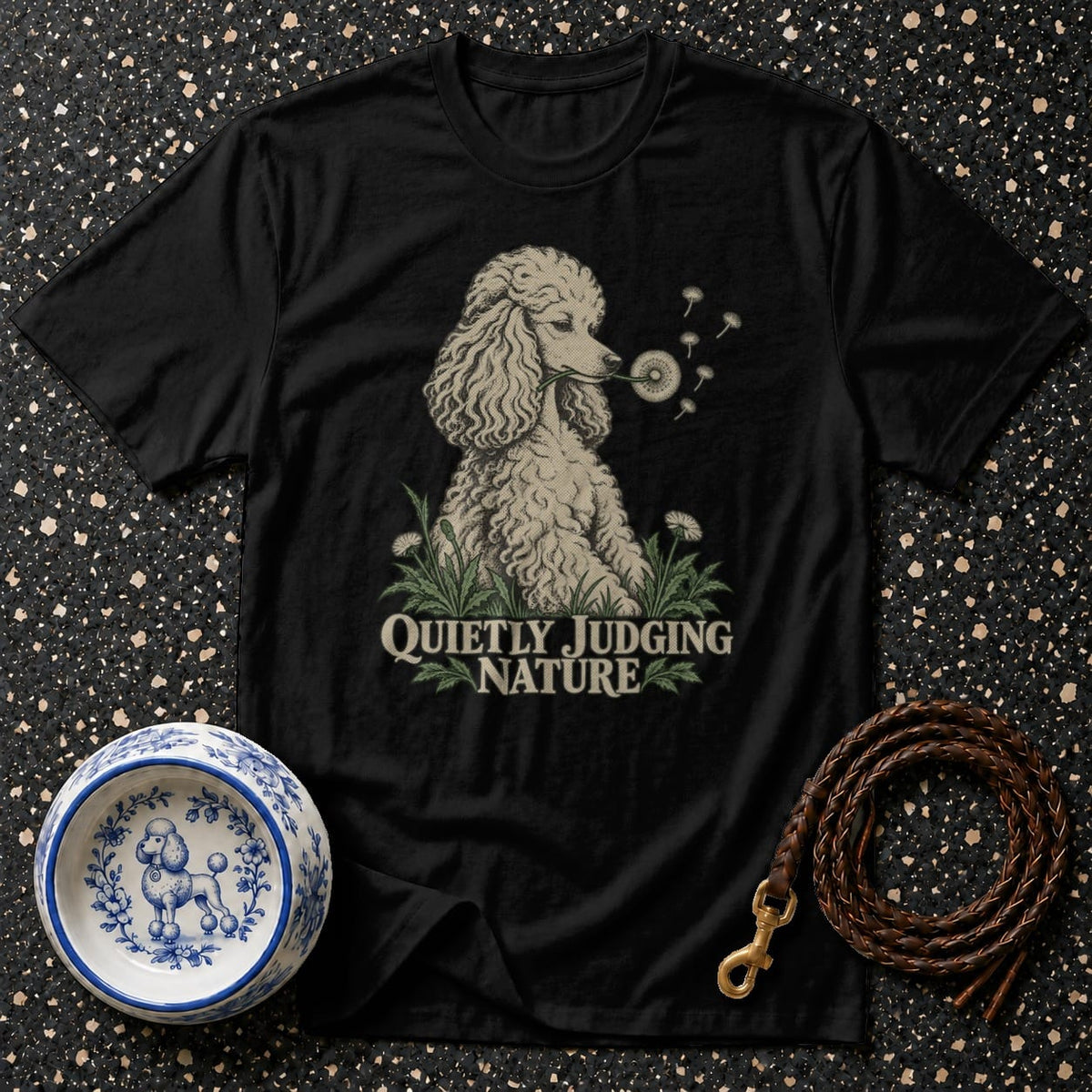 Black t-shirt with poodle blowing dandelions and "Quietly Judging Nature" text.