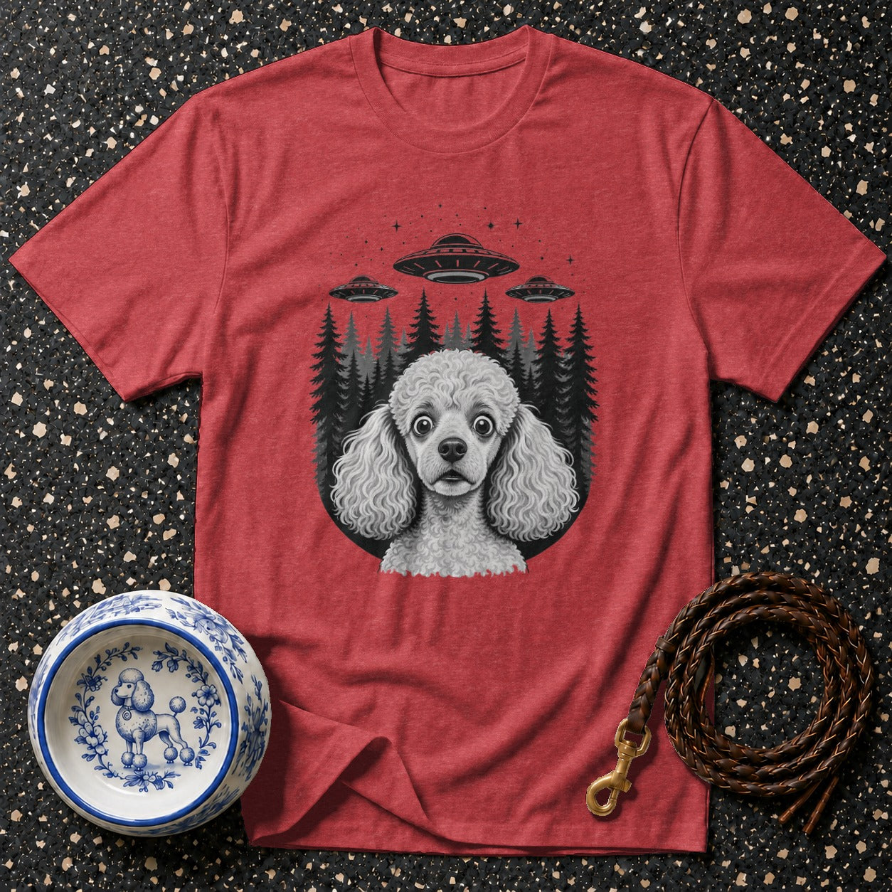Red t-shirt with poodle and UFOs graphic, dog bowl, and leash.