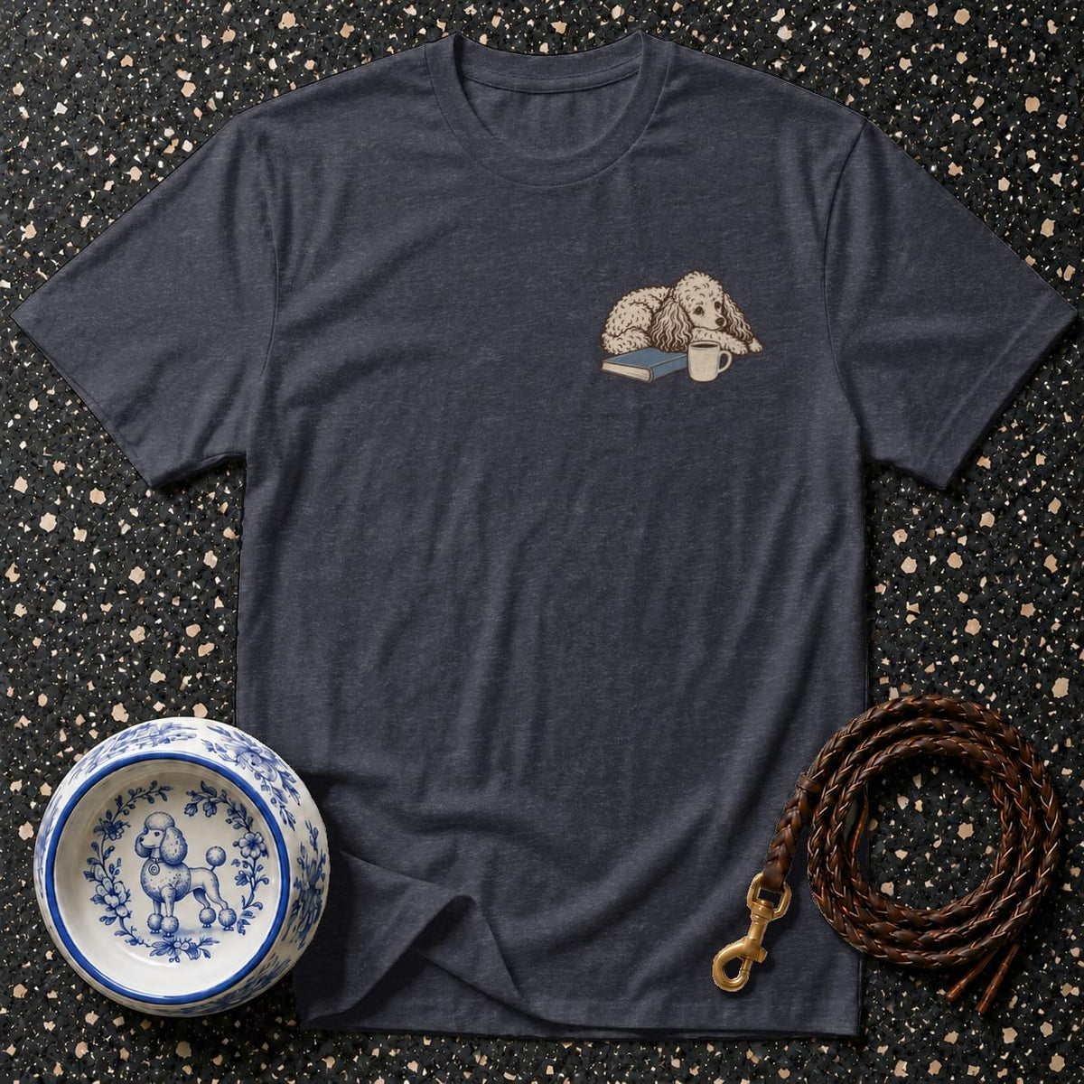 Dark gray t-shirt with embroidered poodle, book, and coffee cup.