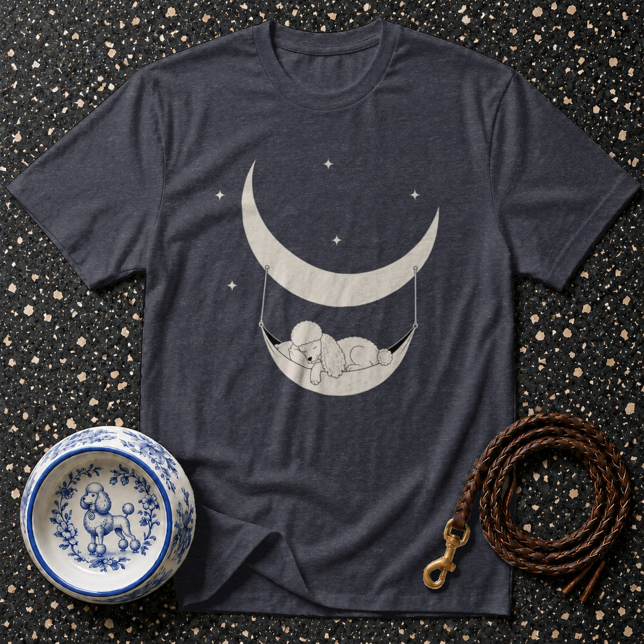 Dark grey t-shirt with a sleeping poodle in a crescent moon hammock graphic.