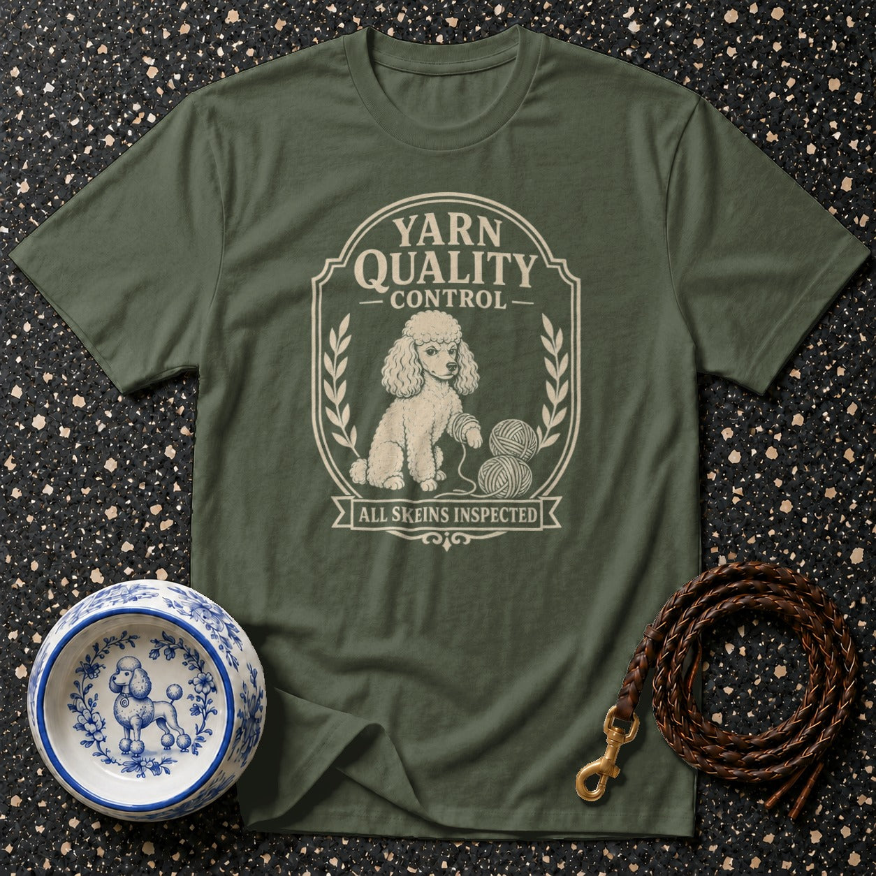 Green t-shirt with poodle graphic reading "Yarn Quality Control, All Skeins Inspected".